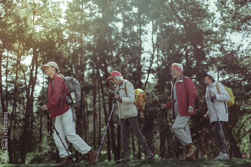 Amateur tourists enjoying one day hike in the forest