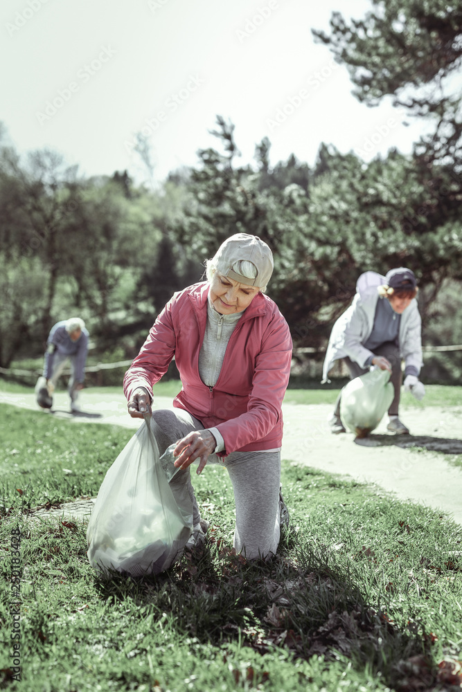 Fototapeta premium Thoughtful old nice grandma thinking about environment