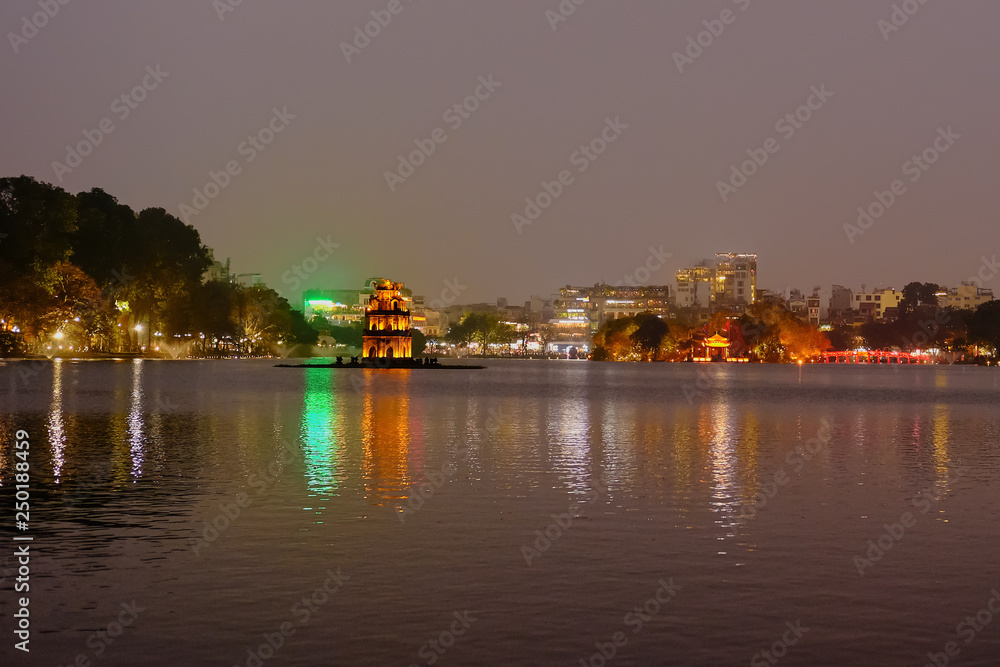 Night view of Turtle Tower or Tortoise tower which is located in the middle of the Hoan Kiem Lake, Hanoi, Vietnam