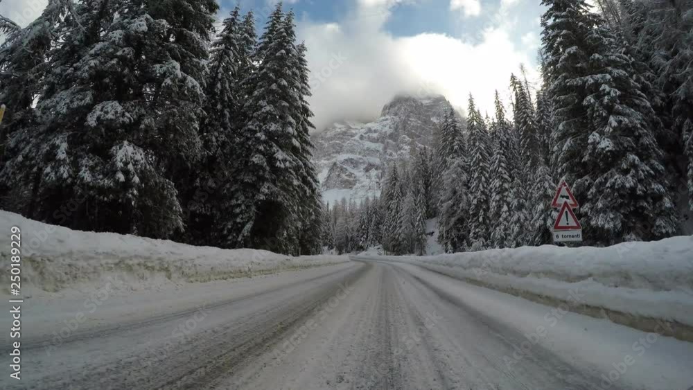 driving car in winter on countryside mountain alps curvy ice covered road italian alps driving car in winter on countryside mountain alps curvy ice covered road italian alps
