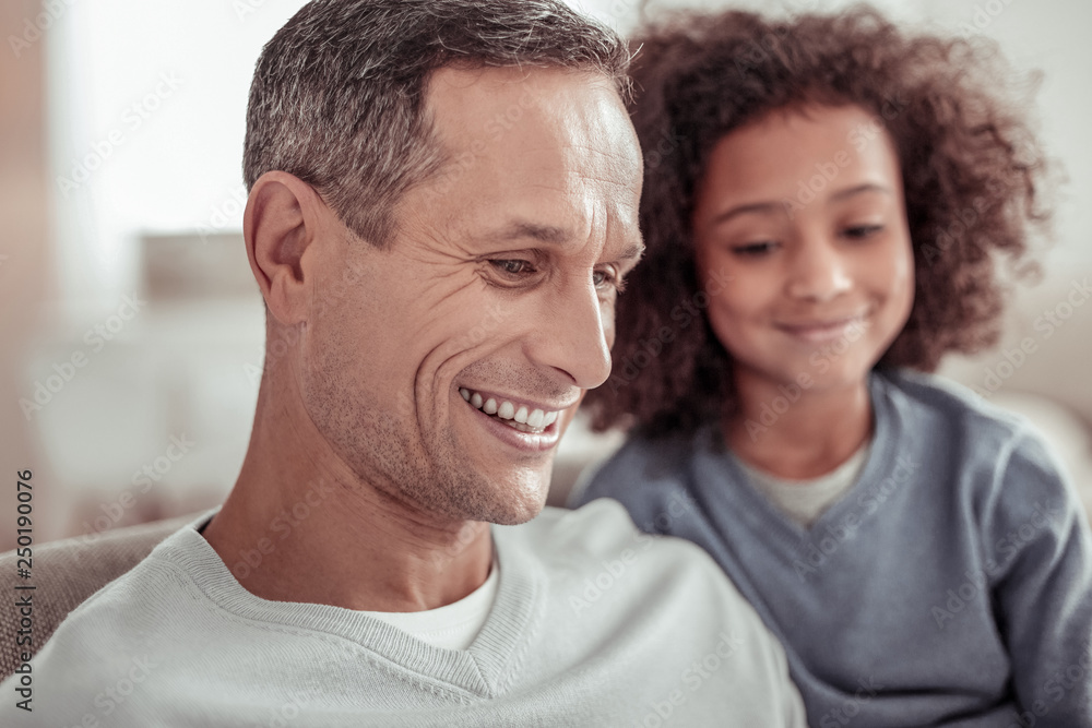 Smiling handsome father spending a day with his daughter Smiling handsome father spending a day with his daughter