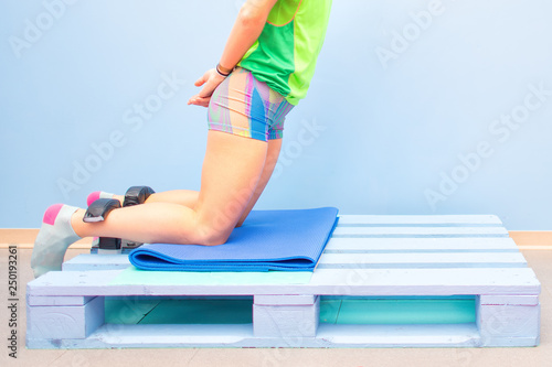 Nordic hamstring exercise on a pallet at the gym