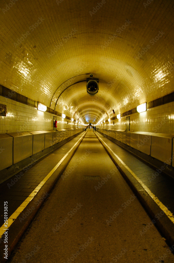 view along the famous Elbtunnel in Hamburg in Germany which connects the Landungsbrücken with the other side of the Elbe