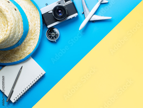 Summer Travel accessories on blue and Yellow background copy space