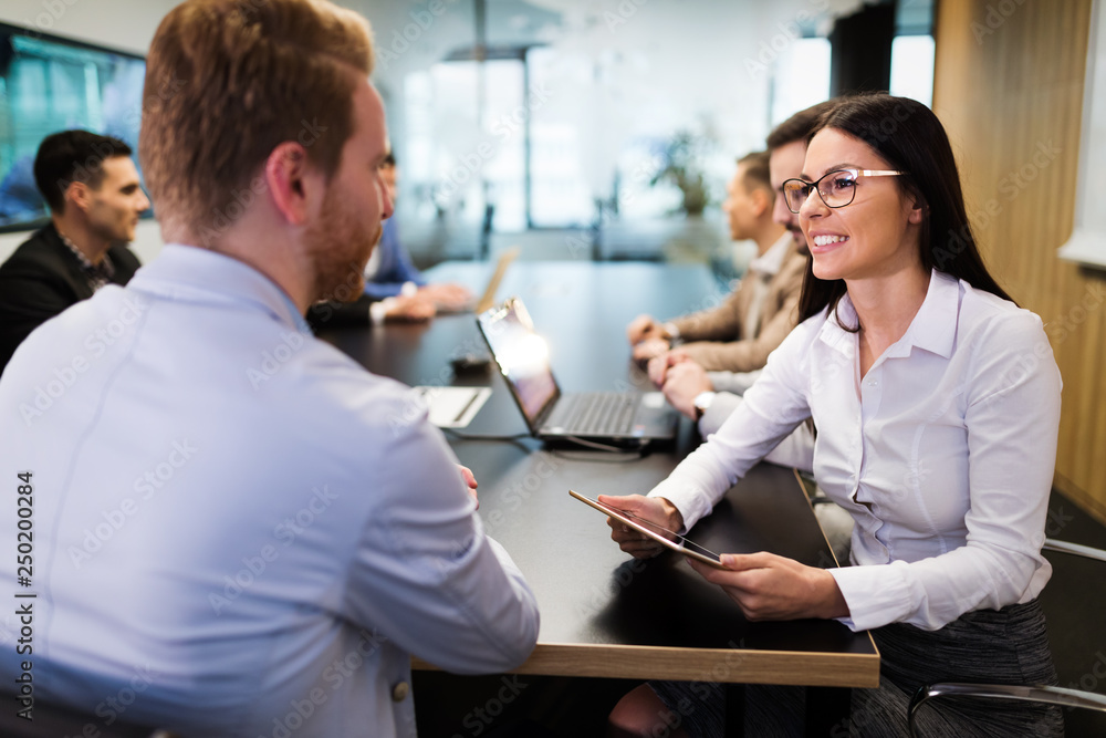 Fototapeta premium Picture of attractive businesspeople in conference room