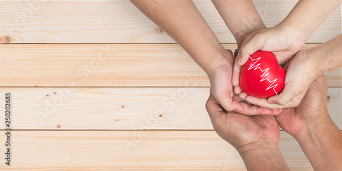 Life and health insurance, pediactric nursing care and childhood cardiovascular heart disease, healthcare concept with child and family parent supporting heart with pulse sign