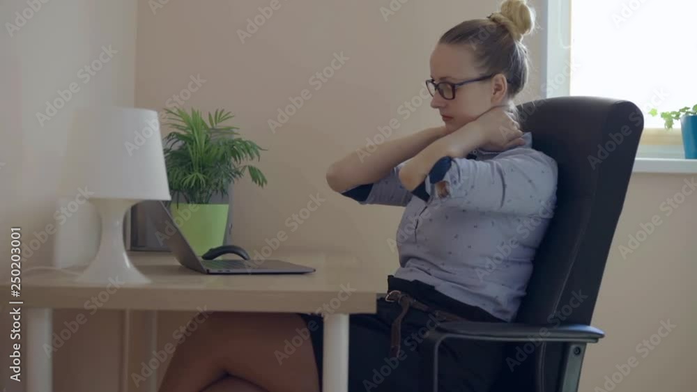Beautiful woman suffering from neck pain in home Beautiful woman suffering from neck pain in home