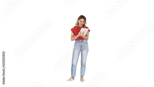Beautiful modern woman using digital tablet on white background.