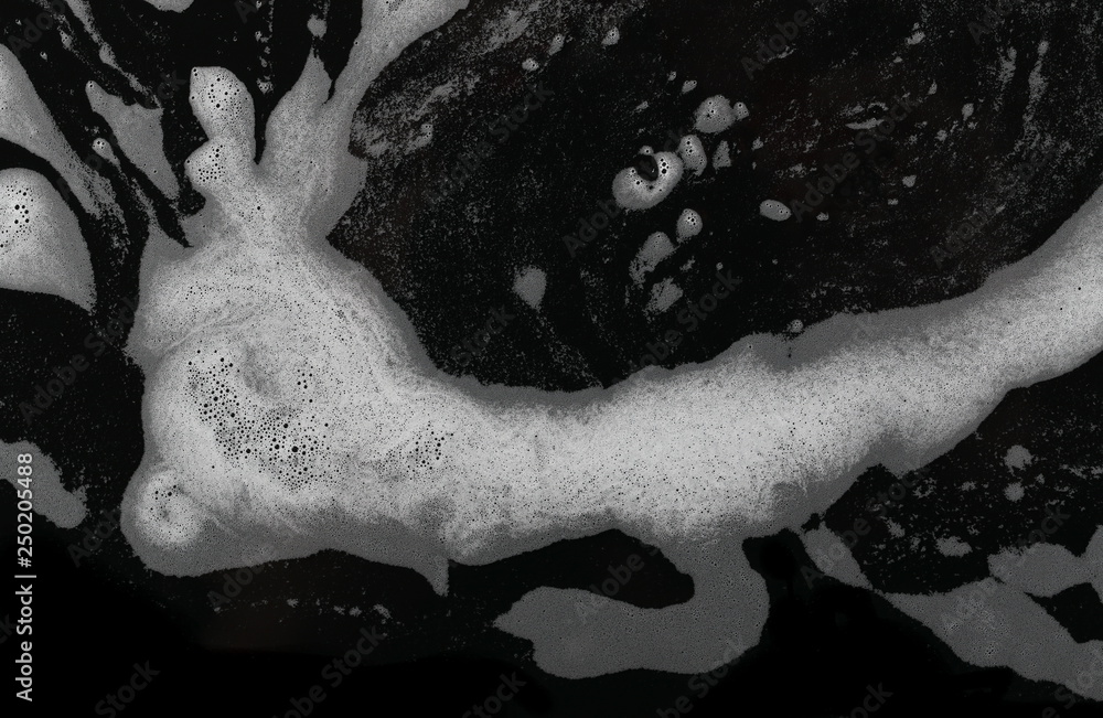 Soap foam, lather isolated on black, with clipping path, texture and background, top view