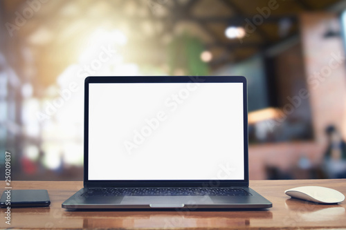 laptop computer blank white screen and mobile on table in cafe background