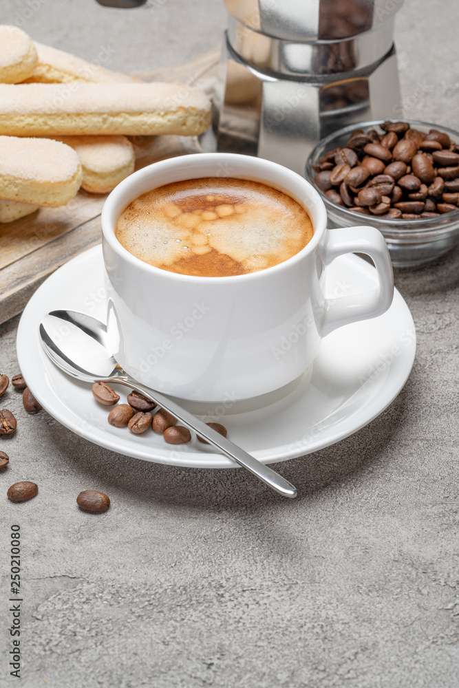 Fototapeta premium Italian Savoiardi ladyfingers Biscuits and cup of coffee on concrete backgound