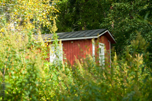KOUVOLA, FINLAND - SEPTEMBER 20, 2018: Beautiful red old wooden house on the territory of Anjala manor. © Elena Noeva
