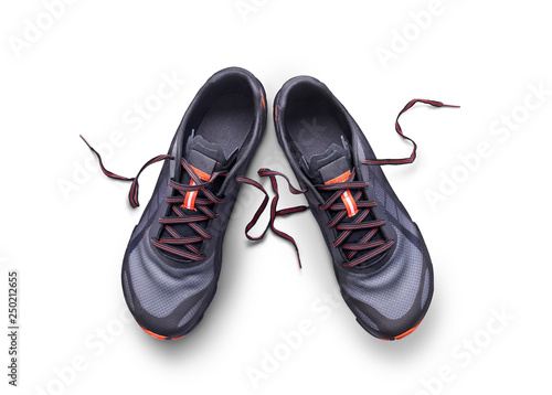 Top view of gray and orange trainers isolated on a white background.