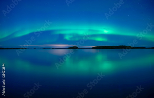 Northern lights background in Farnebofjarden national park in Sweden. © Conny Sjostrom