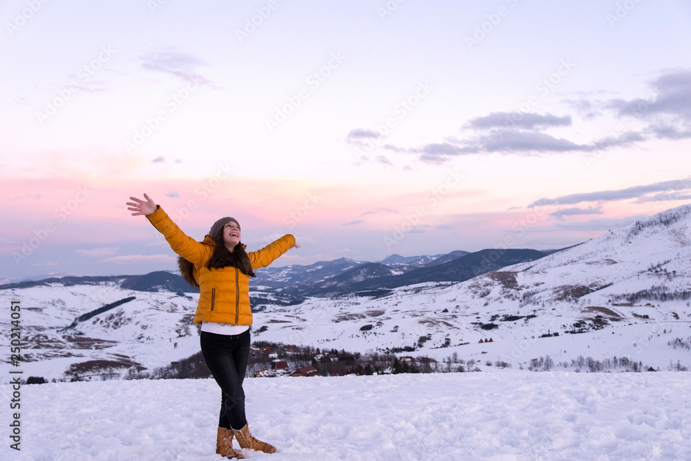 Beautiful and smiling girl on mountain