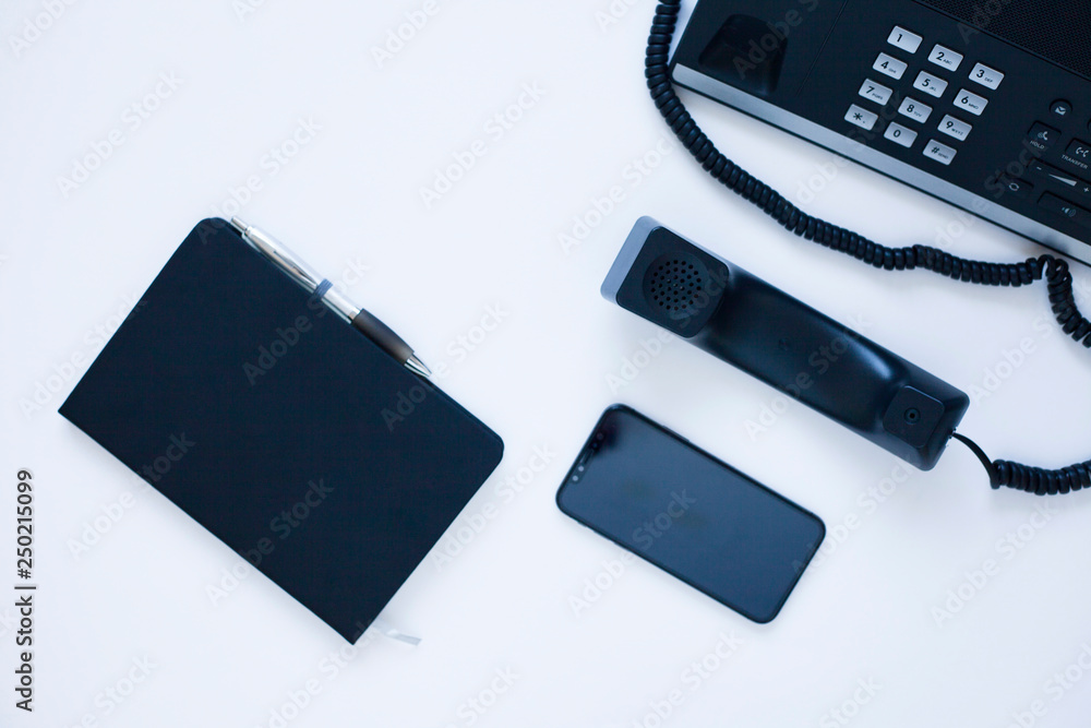 Ip telephony concept. Modern ip phones, sip terminals, conference phones and cameras for video meetings on office background. Top view. Ip telephony concept. Modern ip phones, sip terminals, conference phones and cameras for video meetings on office background. Top view.