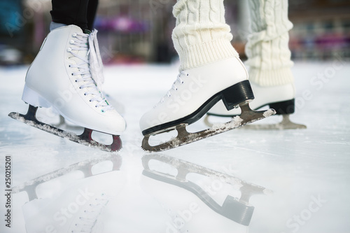 Closeup skating shoes ice skating outdoor at ice rink photo