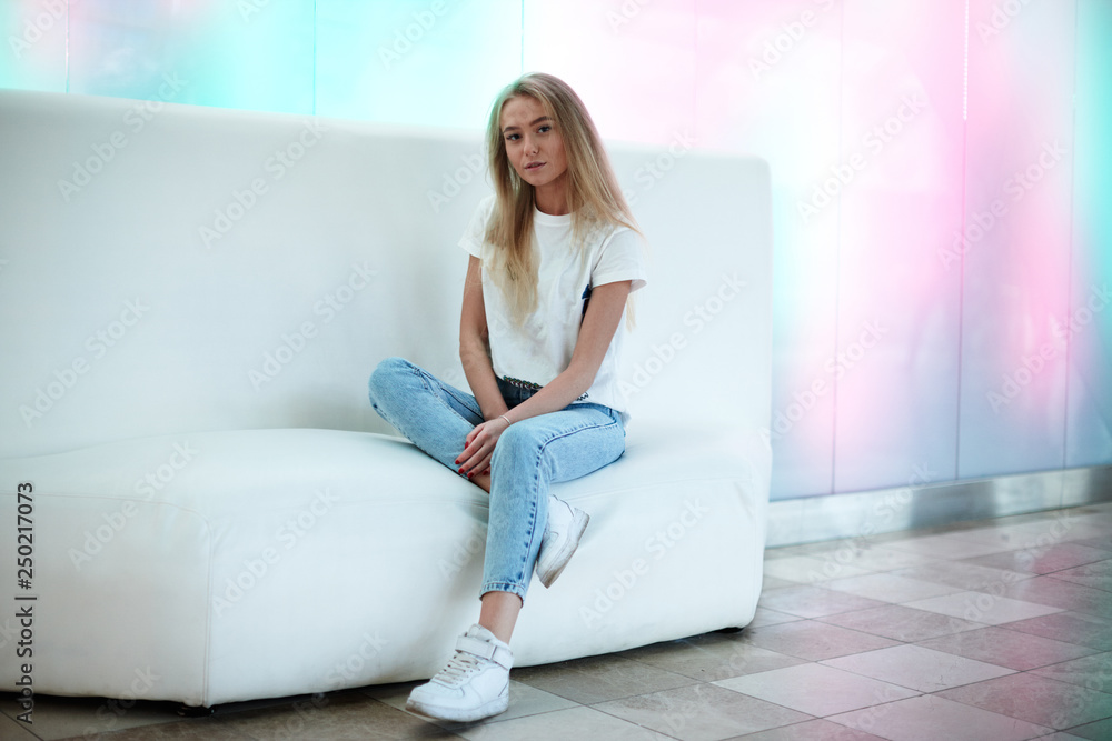 Beautiful blond girl posing at the mall Beautiful blond girl posing at the mall