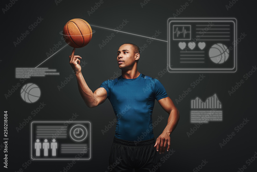 Fototapeta premium Go hard every play. Handsome muscular sportsman standing over dark background. Game concept with graphic drawing.