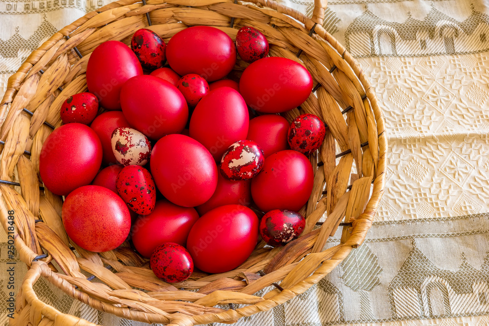 Many Easter red colored eggs in the basket on the table. Top view Many Easter red colored eggs in the basket on the table. Top view