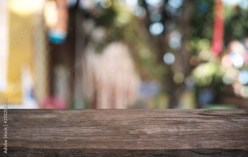 Empty dark wooden table in front of abstract blurred bokeh background of restaurant . can be used for display or montage your products.Mock up for space. Empty dark wooden table in front of abstract blurred bokeh background of restaurant . can be used for display or montage your products.Mock up for space.