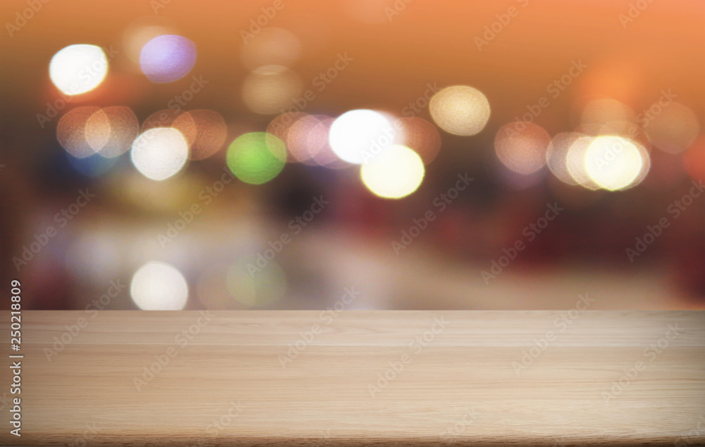 Empty dark wooden table in front of abstract blurred bokeh background of restaurant . can be used for display or montage your products.Mock up for space.