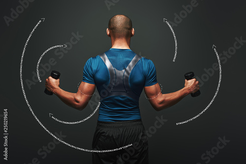 Never give up. Dark skinned sportsman working out with dumbbells over dark background. Graphic drawing.