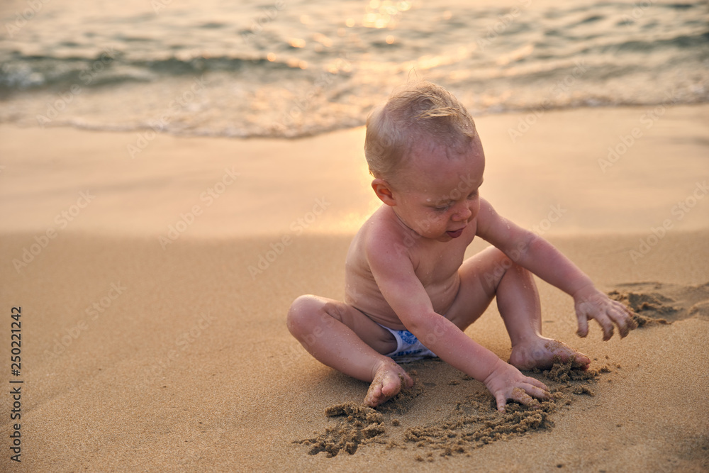 Happy little boy with light after swimming in the sea Happy little boy with light after swimming in the sea