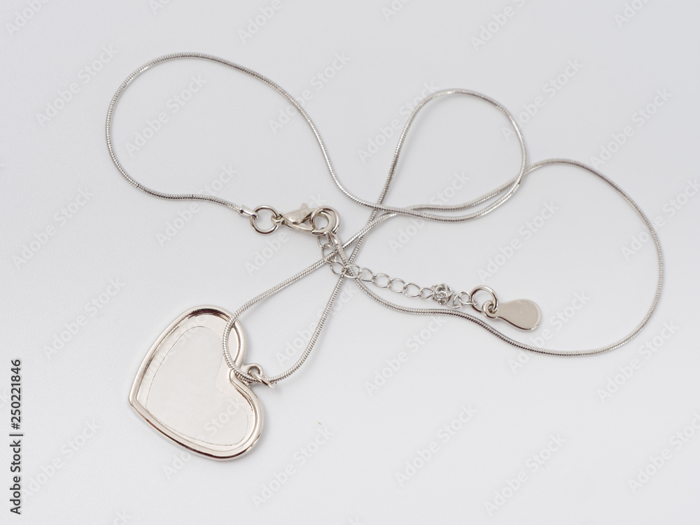 silver trinket with a place for a photo. present. on a white background. silver trinket with a place for a photo. present. on a white background.