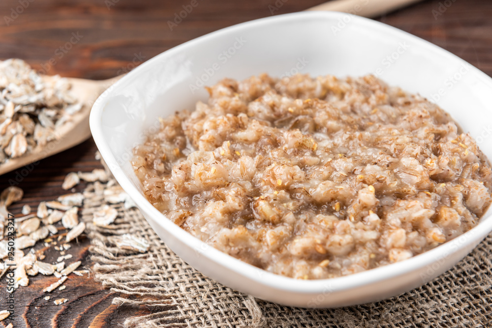 Rye porridge on dark wooden background. Rye porridge on dark wooden background.