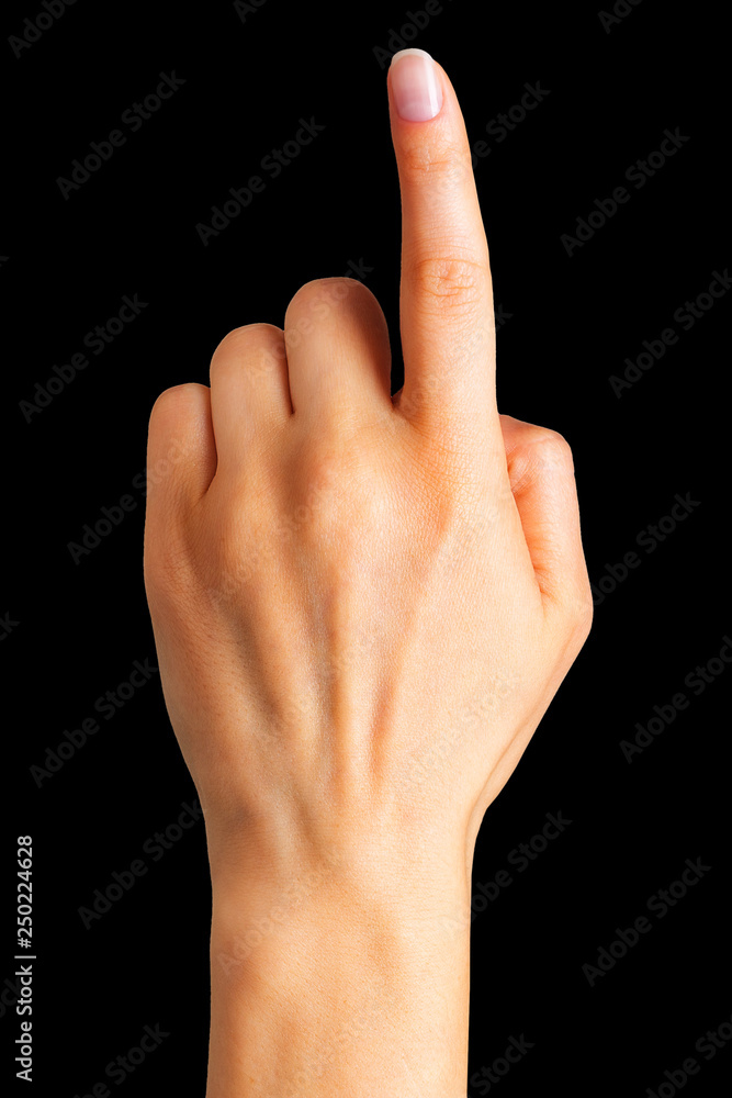Woman hand with the index finger pointing up Woman hand with the index finger pointing up