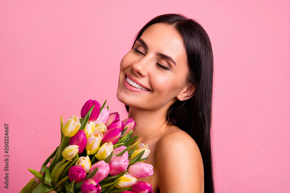 Close-up portrait of her she nice cute attractive lovely winsome charming fascinating cheerful brunette hispanic lady smelling colorful flowers closed eyes advert isolated on pink pastel background Close-up portrait of her she nice cute attractive lovely winsome charming fascinating cheerful brunette hispanic lady smelling colorful flowers closed eyes advert isolated on pink pastel background