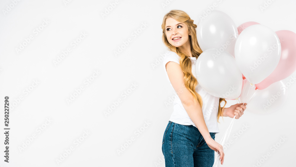 happy attractive woman holding pink and white air balloons on white background with copy space happy attractive woman holding pink and white air balloons on white background with copy space
