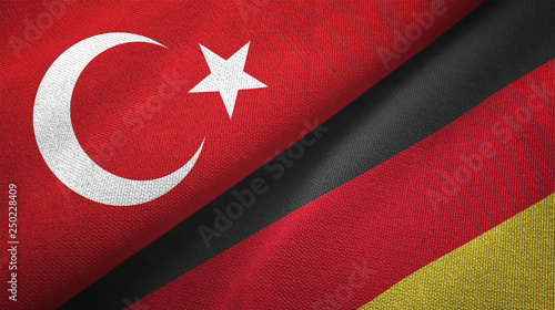 Turkey and Germany two flags textile cloth, fabric texture photo