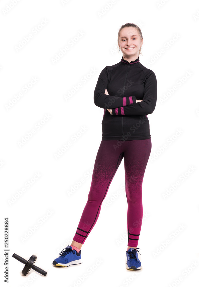 Smiling teen girl in sportswear working out in studio on a white background  Stock Photo | Adobe Stock
