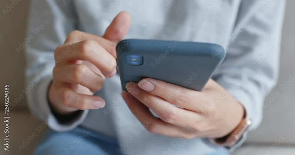 Woman use of smart phone at home Woman use of smart phone at home