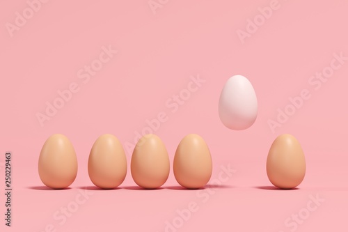 Outstanding white Egg Floating among brown eggs on pink background. minimal Easter idea.