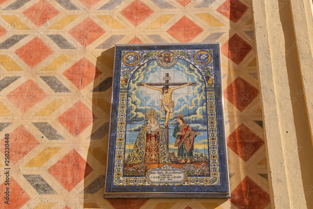 Tiles in a catholic church with artwork of the passion of Jesus Christ