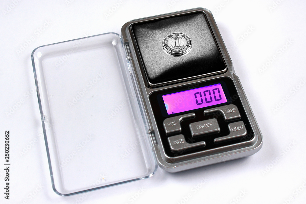 Ukrainian hryvnia coin on scales, shows zero weight. Currency inflation concept. Ukrainian hryvnia coin on scales, shows zero weight. Currency inflation concept.