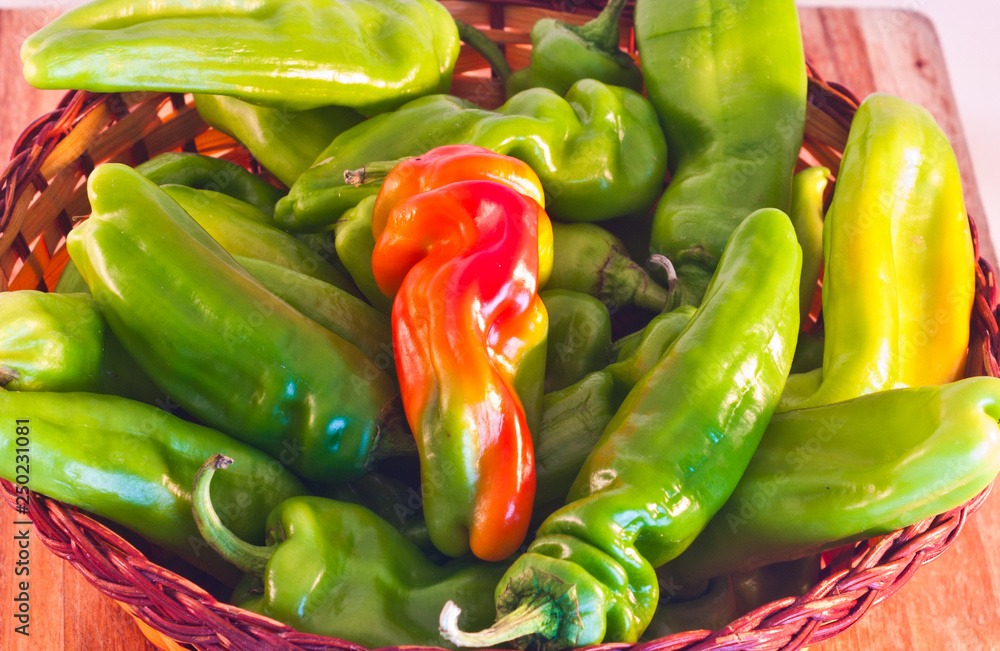 wicker basket with sweet and spicy red and green peppers