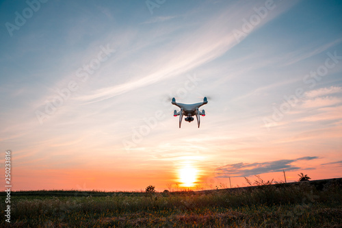 drone quad copter on green corn field © Ruslan Ivantsov