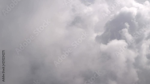 Flight in the clouds in 4K  photo