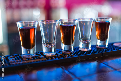 фотографія Several shots of different drinks at a party in a nightclub