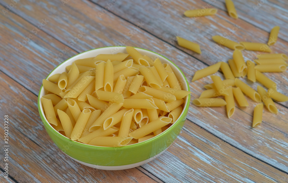 The Penne Rigate in a bowl on the table. The Penne Rigate in a bowl on the table.