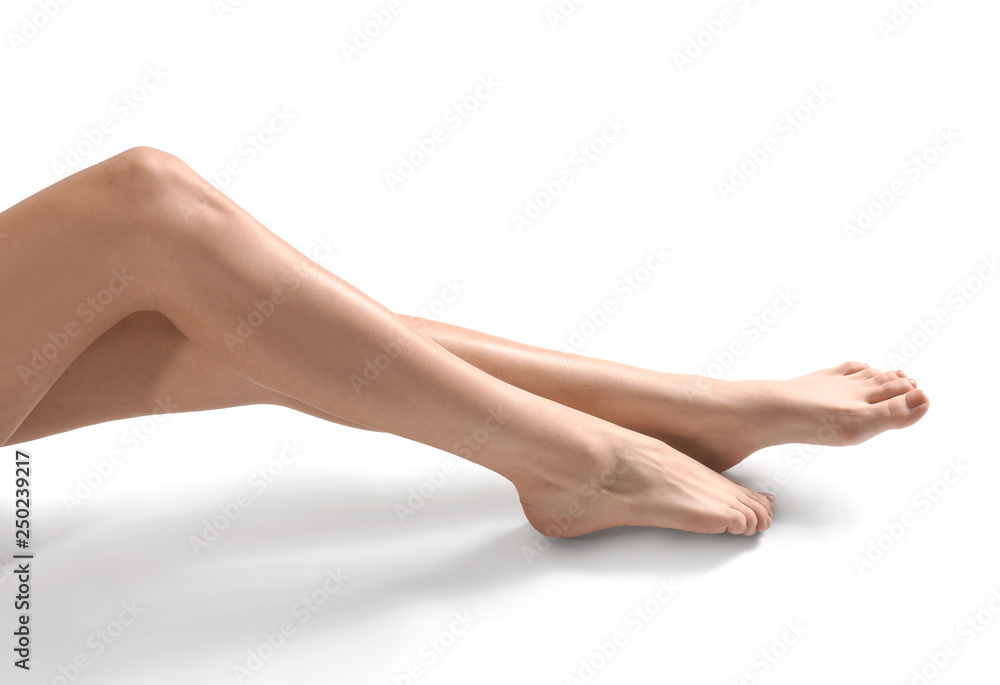 Legs of young woman with beautiful pedicure on white background Legs of young woman with beautiful pedicure on white background