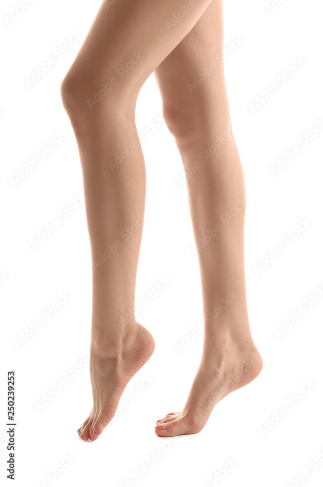 Legs of young woman with beautiful pedicure on white background Legs of young woman with beautiful pedicure on white background
