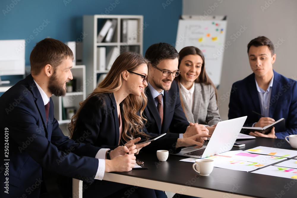 Group of people discussing business plan in office Group of people discussing business plan in office