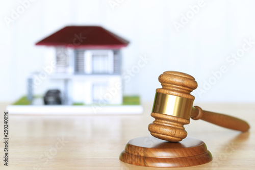 Property auction, Gavel wooden and model house on wtite background, lawyer of home real estate and ownership property concept