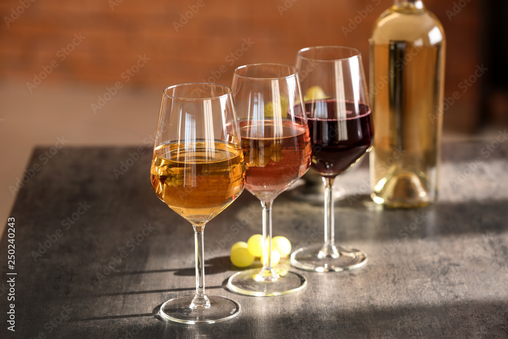 Glasses of different sorts of wine on table Glasses of different sorts of wine on table