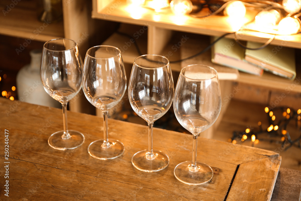 Empty wineglasses on wooden table Empty wineglasses on wooden table